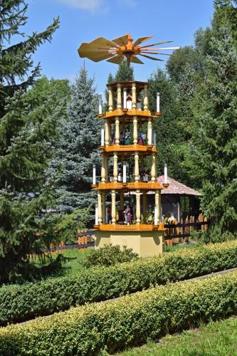 a large building with a windmill on top of it at RATAGS Kunsthandwerkerhaus in Langenwolmsdorf