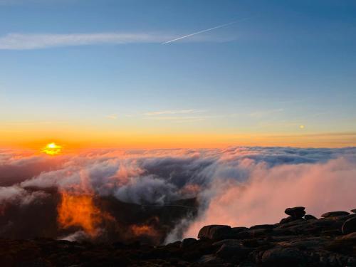 a view of the sunset from the top of a mountain at Quinta Alma Verde in Póvoa das Quartas