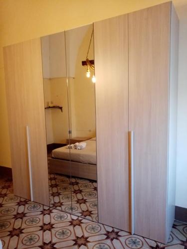 a room with a closet with a bed in it at Casa Paola in Cutrofiano