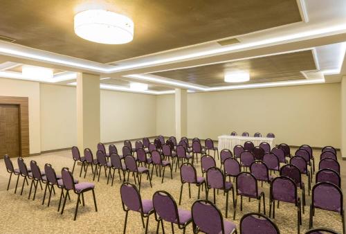 a room with purple chairs and a table in it at Labranda Ephesus Princess - All Inclusive in Kusadası