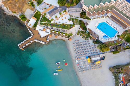 an aerial view of a resort with a pool at Design Plus Seya Beach Hotel in Alacati