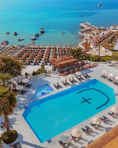 an aerial view of a resort with a swimming pool at Design Plus Seya Beach Hotel in Alacati