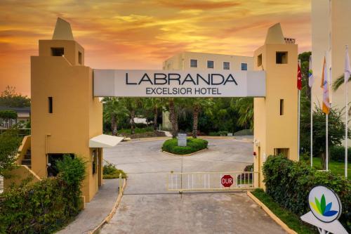 a sign for the entrance to a hotel at Labranda Excelsior Hotel in Side