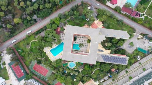 an overhead view of a house with a swimming pool at Asteria Collection Side in Side