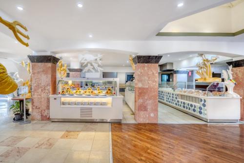 a bakery with a lot of food on display at Asteria Collection Side in Side