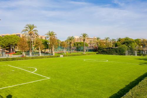 a green soccer field with a soccer ball at Asteria Family Resort Belek in Belek