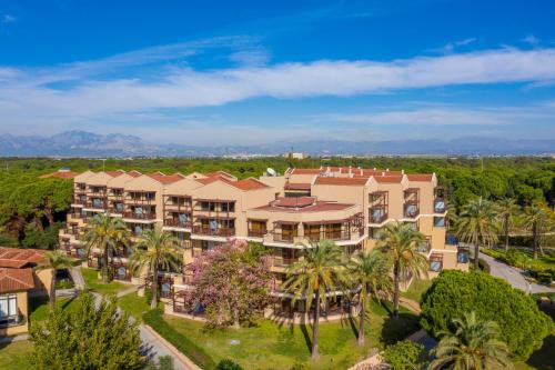 an aerial view of a resort with palm trees at Asteria Family Resort Belek in Belek