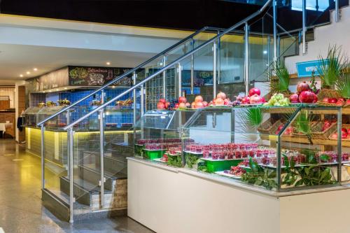 a store filled with lots of fruits and vegetables at Asteria Family Resort Belek in Belek
