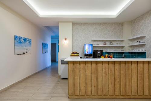a kitchen with a wooden counter and a counter top at Asteria Family Resort Belek in Belek