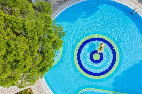 an overhead view of a swimming pool with a boat at Asteria Family Resort Belek in Belek