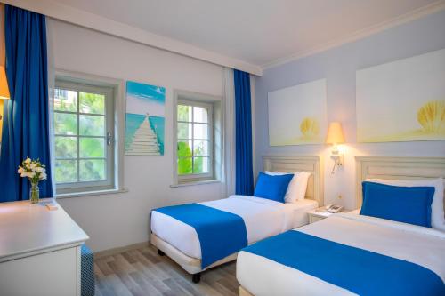 Ένα ή περισσότερα κρεβάτια σε δωμάτιο στο Selectum Collection Bodrum
