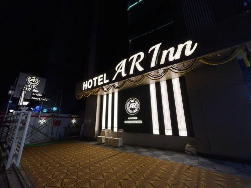 a hotel american sign on the side of a building at Hotel AR Inn in Thane