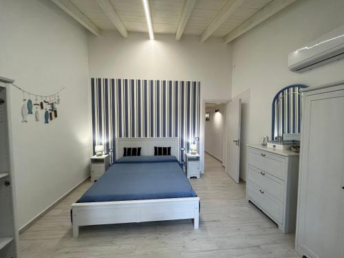 Villa Sovareto tesisinde bir odada yatak veya yataklar
