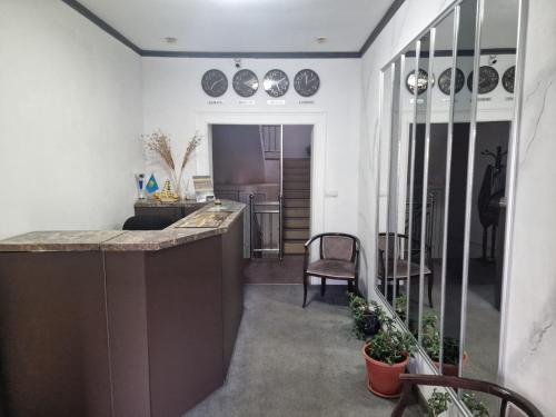 a kitchen with a counter and a dining room at Ajour in Almaty
