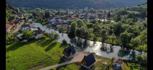 an aerial view of a village with a river at Bungalow Jajce 1 in Jezero