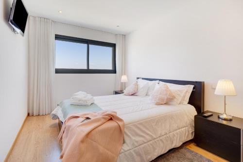 Postel nebo postele na pokoji v ubytování Sublime Mundo Apartamento