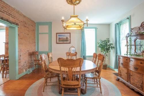 a dining room with a table and chairs at Cozy Cow in Gettysburg