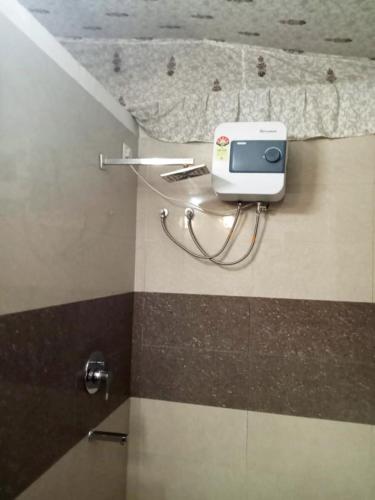 a bathroom with a camera on the floor of a room at Virat Resorts, Sariska Rajasthan in Bairāt