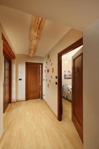 an empty room with a door and a bedroom at Locanda Occitana Cà Bianca in Roccabruna