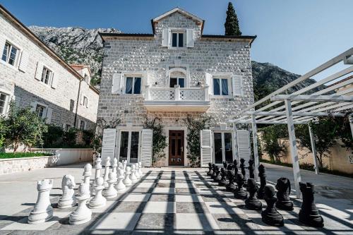 a giant chess board in front of a building at Villa Shah Complex in Kotor