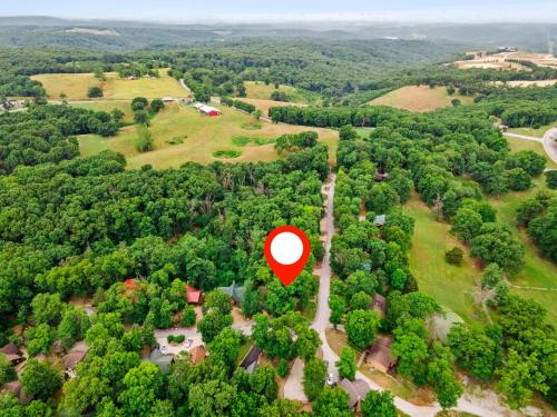 an aerial view of a red circle in the middle of a forest at Three Bear Lodge in Ridgedale