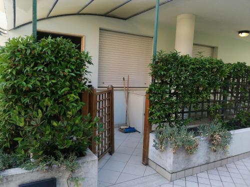 a patio with a fence and some plants at Residence Oltremare in San Benedetto del Tronto