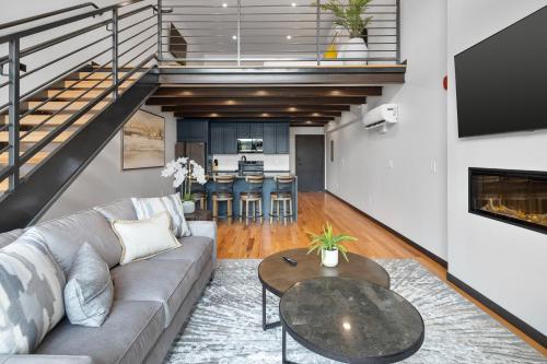 a living room with a couch and a table at McGregor & Main - Luxury Lofts in Hill City