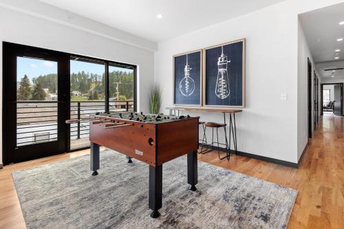 a living room with a foosball table in it at McGregor & Main - Luxury Lofts in Hill City