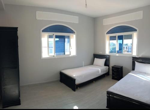 Letto o letti in una camera di Appartement avec grande terrasse NEYLA Del Mar Inn Tanger