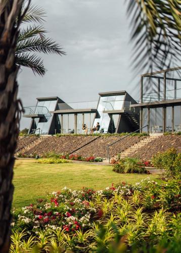 a house on top of a hill with flowers at Beyond by Sula in Nashik