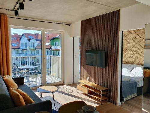 Postel nebo postele na pokoji v ubytování Green Port SPA Kołobrzeg STYLOWY LOFT- w cenie klimatyzacja, baseny, 2 jacuzzi, sauna, szlafroki, bawialnia