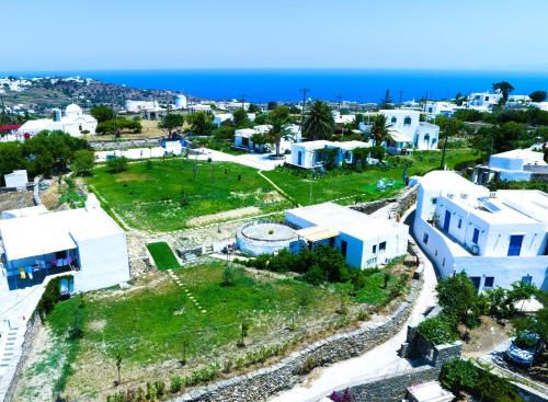 an aerial view of a town with white buildings and the ocean at ANCIENT MEROPIA, Apollonia in Apollonia
