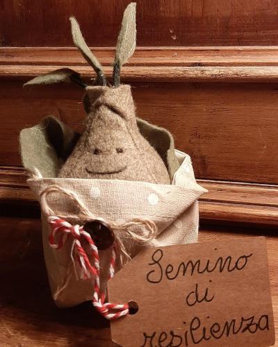 a picture of a stuffed animal in a bag with a sign at B&B dell'Osteria in SantʼAnatolia di Narco