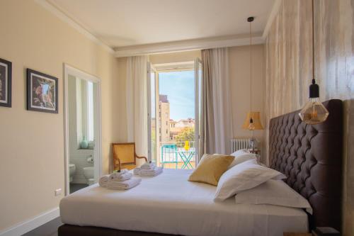 Postel nebo postele na pokoji v ubytování Leopolda Home - Florence Dolce Vita