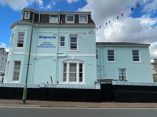 a blue building on the side of a street at Belgravia Luxury Holiday Apartments in Torquay
