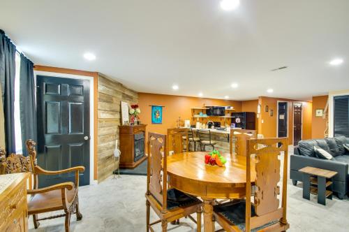 a kitchen and living room with a table and a couch at Charming Virginia Getaway Near Hiking and Golfing! in Lynchburg