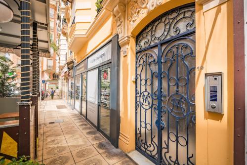 an alley with an iron gate on a building at 2mn Monaco - Luxueux appartement rénové - AS in Beausoleil