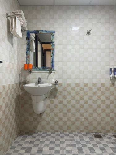 a bathroom with a sink and a mirror at Minh Anh House in Sa Pa