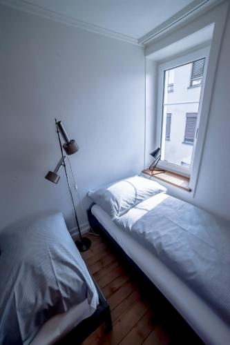 Ένα ή περισσότερα κρεβάτια σε δωμάτιο στο Tilia Apartments