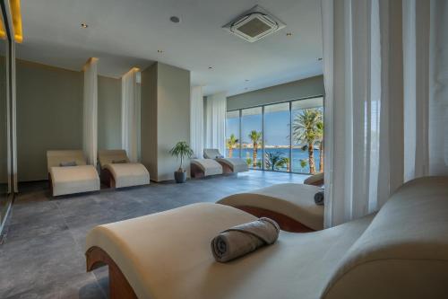 a hotel room with beds and a view of the ocean at Mirada Exclusive Bodrum in Bodrum City