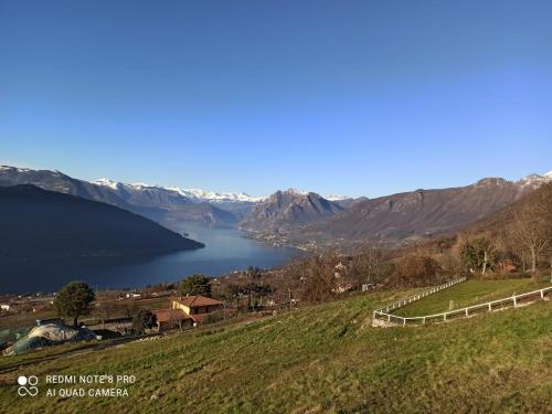 a view of a lake with mountains in the background at PANORAMIC GREEN VALLEY in Sulzano
