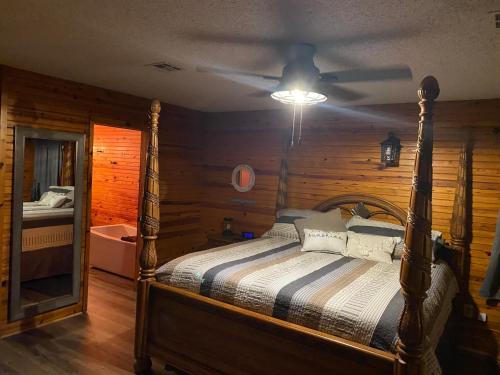 a bedroom with a bed and a ceiling fan at Off the Hook in Eufaula