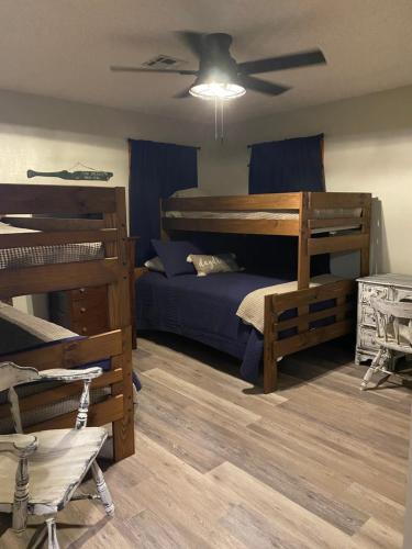 a bedroom with a bed and a ceiling fan at Off the Hook in Eufaula