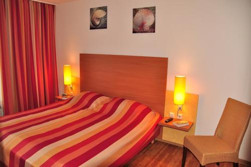 Postel nebo postele na pokoji v ubytování Strand-FeWo-Cuxhaven - Duhnen