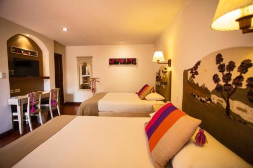 Кровать или кровати в номере Hotel Rosario La Paz