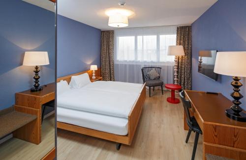 Кровать или кровати в номере Hotel & Restaurant Chärnsmatt
