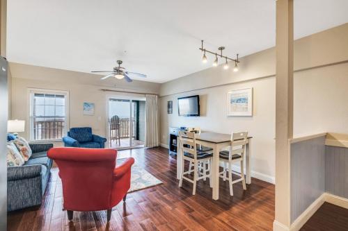 a living room with a couch and a table at FFR114 - Nemo's Retreat in Kill Devil Hills