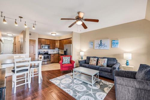 a living room with a couch and a table at FFR114 - Nemo's Retreat in Kill Devil Hills