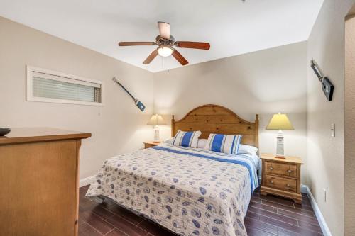 a bedroom with a bed and a ceiling fan at FFR114 - Nemo's Retreat in Kill Devil Hills