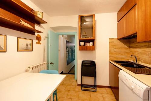 a kitchen with a sink and a counter top at Casa La Polpessa in Tellaro